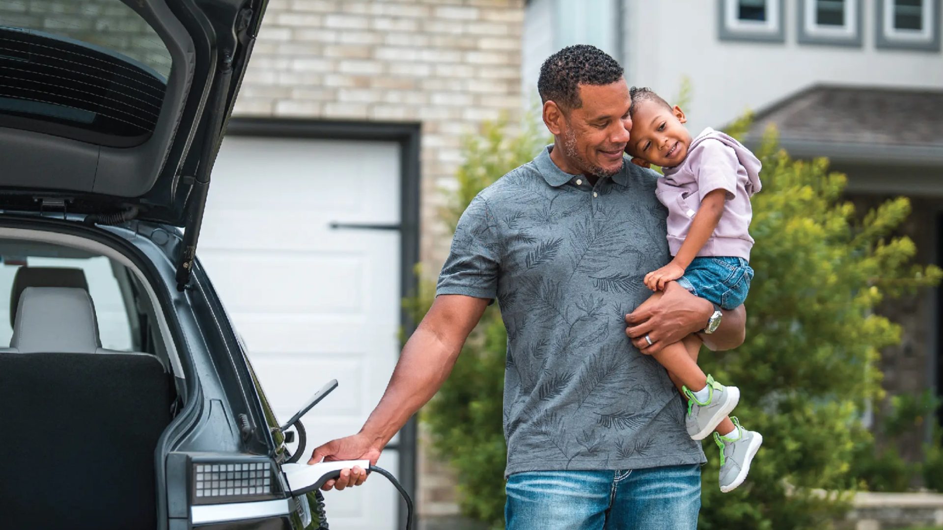 dad and daughter ev charging